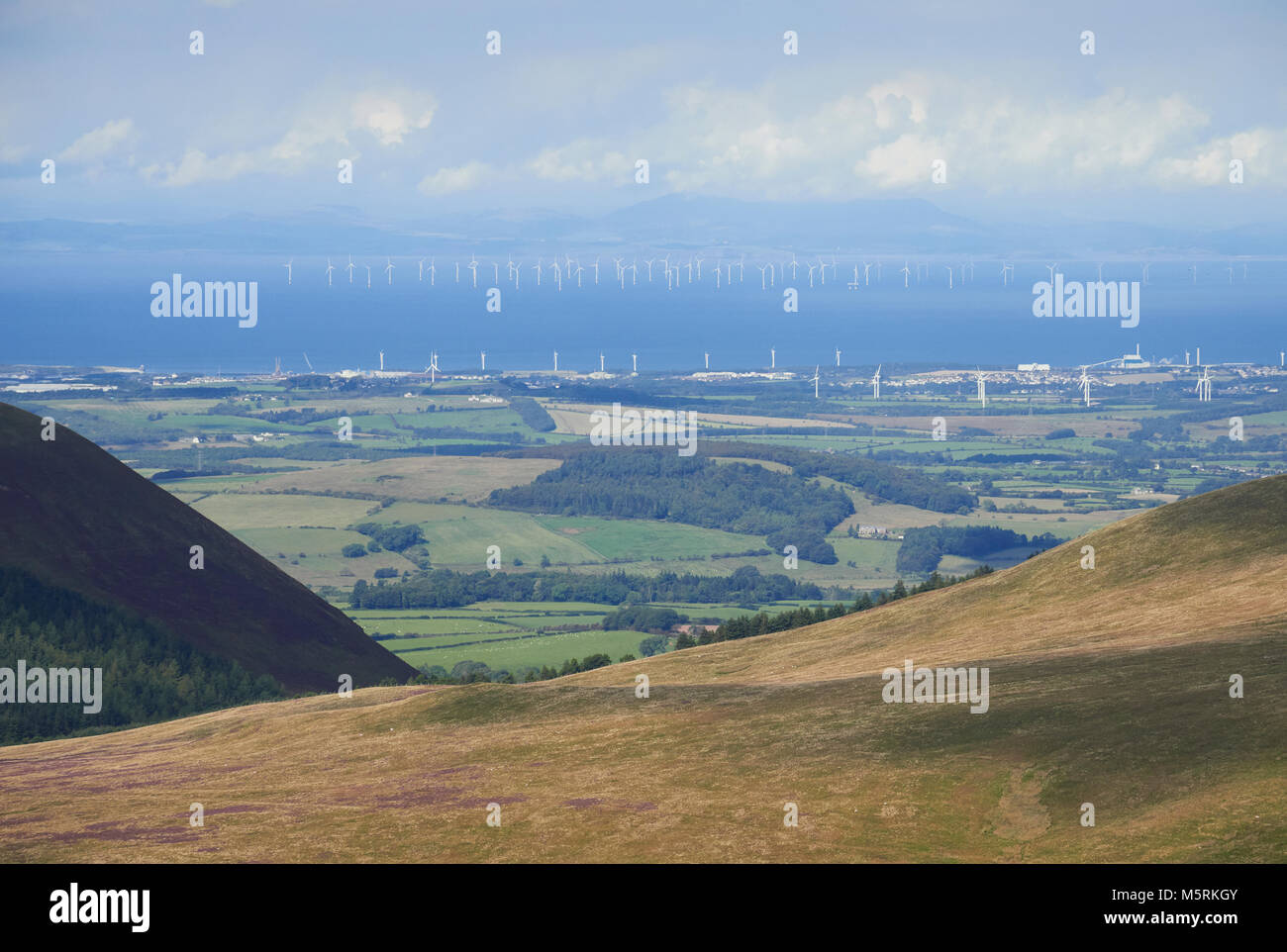 Robin Rigg Wind Farm on the Solway Firth from the summit of Great Borne in the English Lake District, UK. Stock Photo