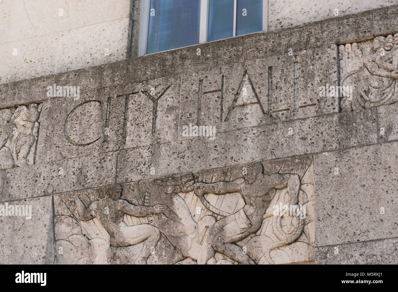 City Hall sign on the front facade of building Stock Photo
