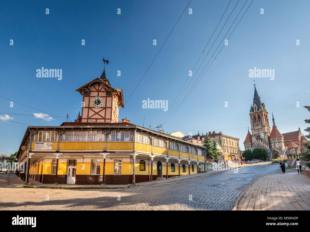 Town Hall and Polish Roman Catholic Church of Saint Stanislaus in Chortkiv, Ternopil Oblast, Ukraine Stock Photo
