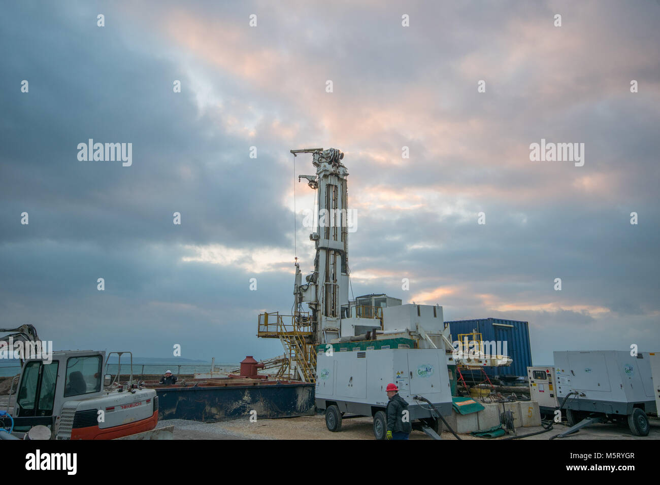 Jubilee Pool, Penzance, Cornwall, UK. 26th Feb 2018. UK Weather. On an aptly freezing cold morning, with siberian winds hitting Cornwall from the 'beast in the east' workers are getting ready to drill a 1.4km deep  bore hole to supply geothermal heat to part of the Jubilee Lido outdoor swimming pool.  This is the first such scheme undertaken in the UK. Credit: Simon Maycock/Alamy Live News Stock Photo
