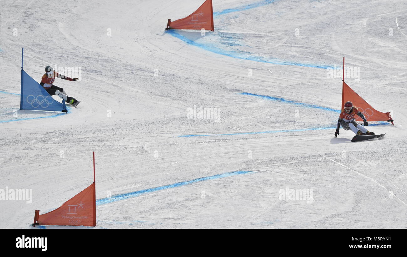 Czech snowboarder and skier Ester Ledecka, 22, a double gold medalist, right and Patrizia Kummer of Switzerland in action during the parallel giant slalom in snowboarding at the Olympics. PyeongChang, South Korea, February 24, 2018. (CTK Photo/Michal Kamaryt) Stock Photo