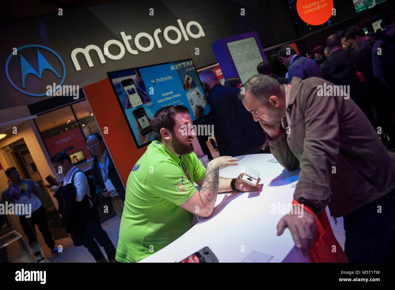 Barcelona, Spain. 26 Feb, 2018.  A motorola specialist explains the new features of the new Moto G6 to an assistant at the Wolrd Congress mobile. The congress begins this Monday in Barcelona and has overcome the success of the last edition. Credit: Charlie Perez/Alamy Live News Stock Photo