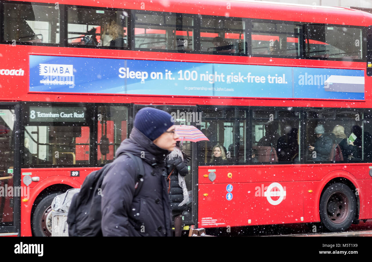 London, UK. 26th Feb, 2018. UK Weather.Morning commuters travelling to work through a light snow fall in the City of London. Credit: Milton Cogheil/Alamy Live News Stock Photo