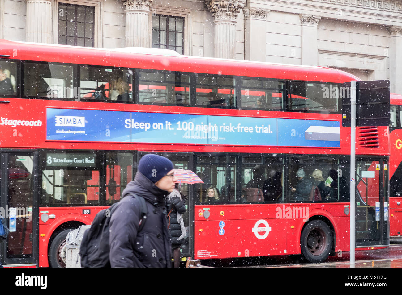 London, UK. 26th Feb, 2018. UK Weather.Morning commuters travelling to work through a light snow fall in the City of London. Credit: Milton Cogheil/Alamy Live News Stock Photo