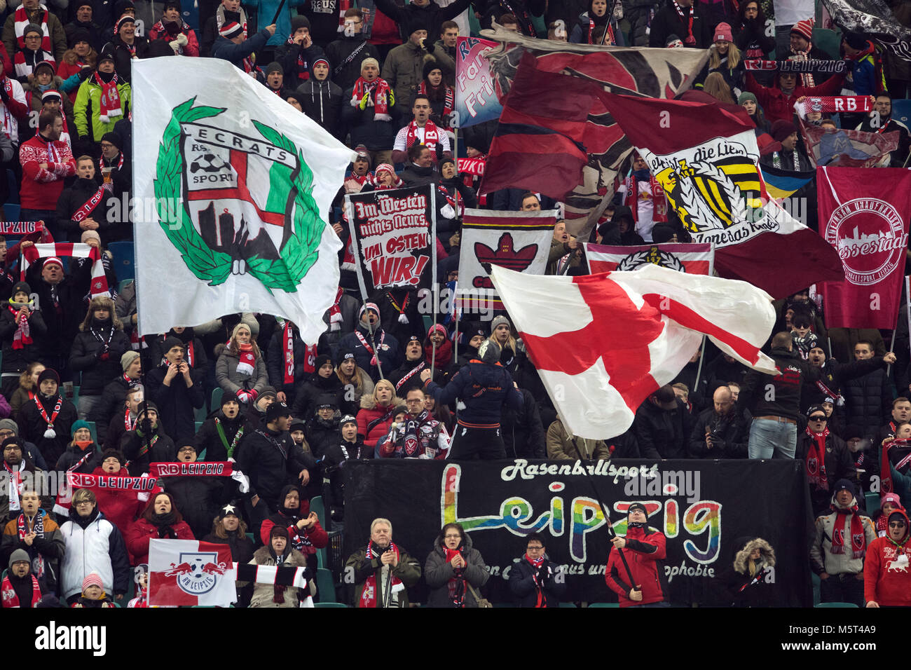 25 Febuary 2018, Germany, Leipzig: German Bundesliga soccer match between RB Leipzig and 1. FC Cologne, Red Bull Arena: Leipzigs fans cheer on their team before the start of the match. Photo: Soeren Stache/dpa - Nutzung nur nach vertraglicher Vereinbarung Stock Photo