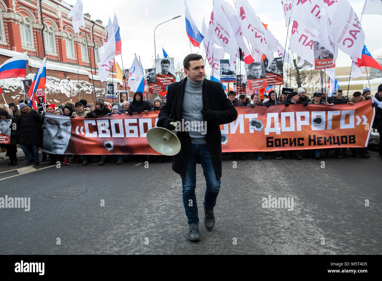 Moscow, Russia. 25th February 2018. Chairman of Moscow's Krasnoselsky District Council, opposition activist Ilya Yashin (front) takes part in a march in Moscow's Prospekt Akademika Sakharova Street in memory of Russian politician and opposition leader Boris Nemtsov on the eve of the 3rd anniversary of his death. Boris Nemtsov was shot dead on Bolshoi Moskvoretsky Bridge in the evening of February 27, 2015. Credit: Victor Vytolskiy/Alamy Live News Stock Photo