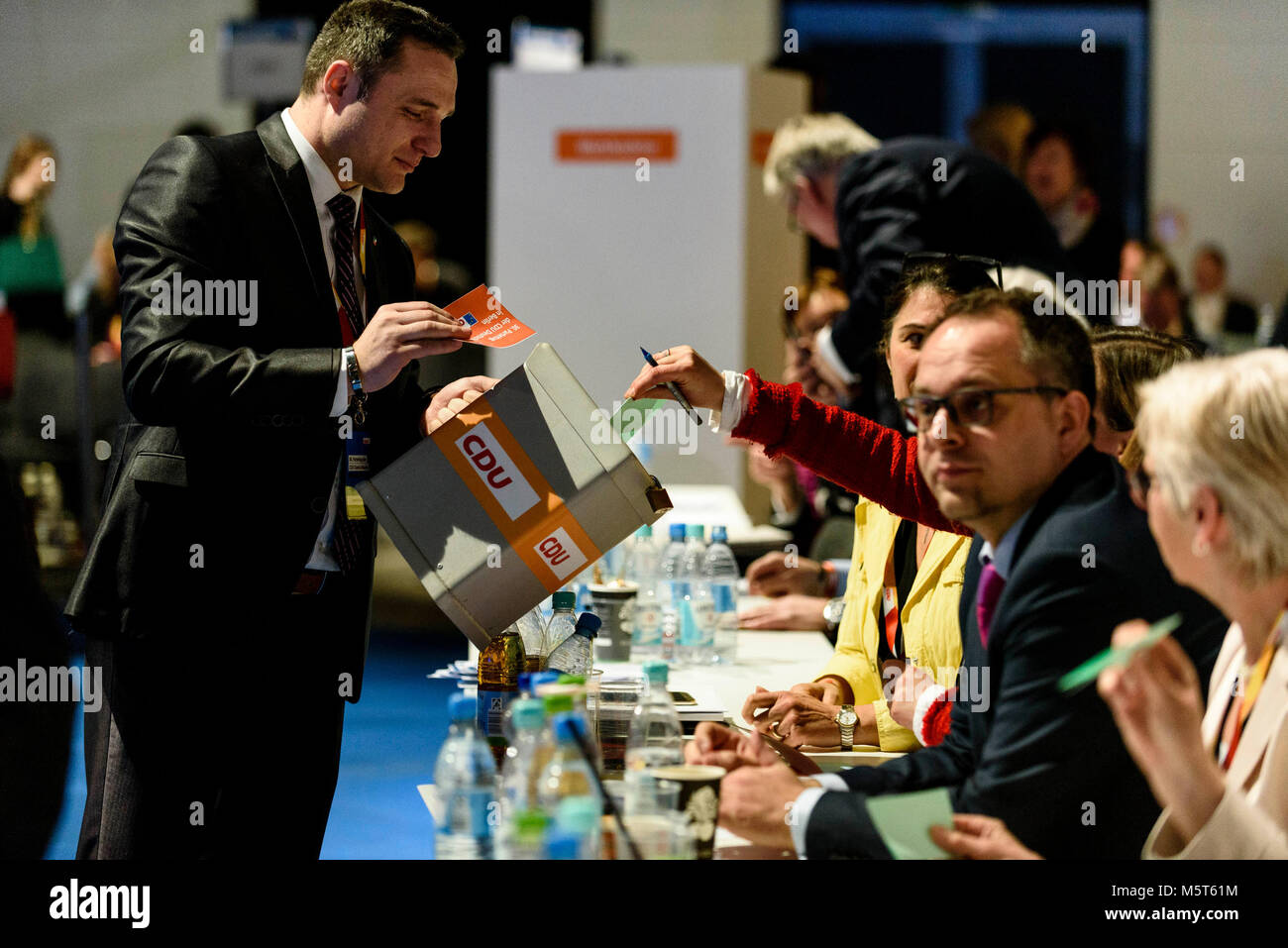 Berlin, Germany. 26th Feb, 2018. Deutschland, Berlin - 26.02.2018.CDU Mitglieder werfen ihre Stimmzettel fÃ¼r die Wahl der CDU GeneralsekretÃ¤rin in die Wahlurne wÃ¤hrend des 30. Parteitag der CDU. Die CDU stimmt heute auf einem Parteitag in Berlin Ã¼ber den mit CSU und SPD ausgehandelten Koalitionsvertrag ab.Germany, Berlin - 26.02.2018.CDU members cast their ballots for the election of CDU General Secretary in the ballot box during the 30th congress of the CDU. The CDU votes today at the party convention in Berlin on the coalition agreement negotiated with the CSU and the SPD. Fot Stock Photo