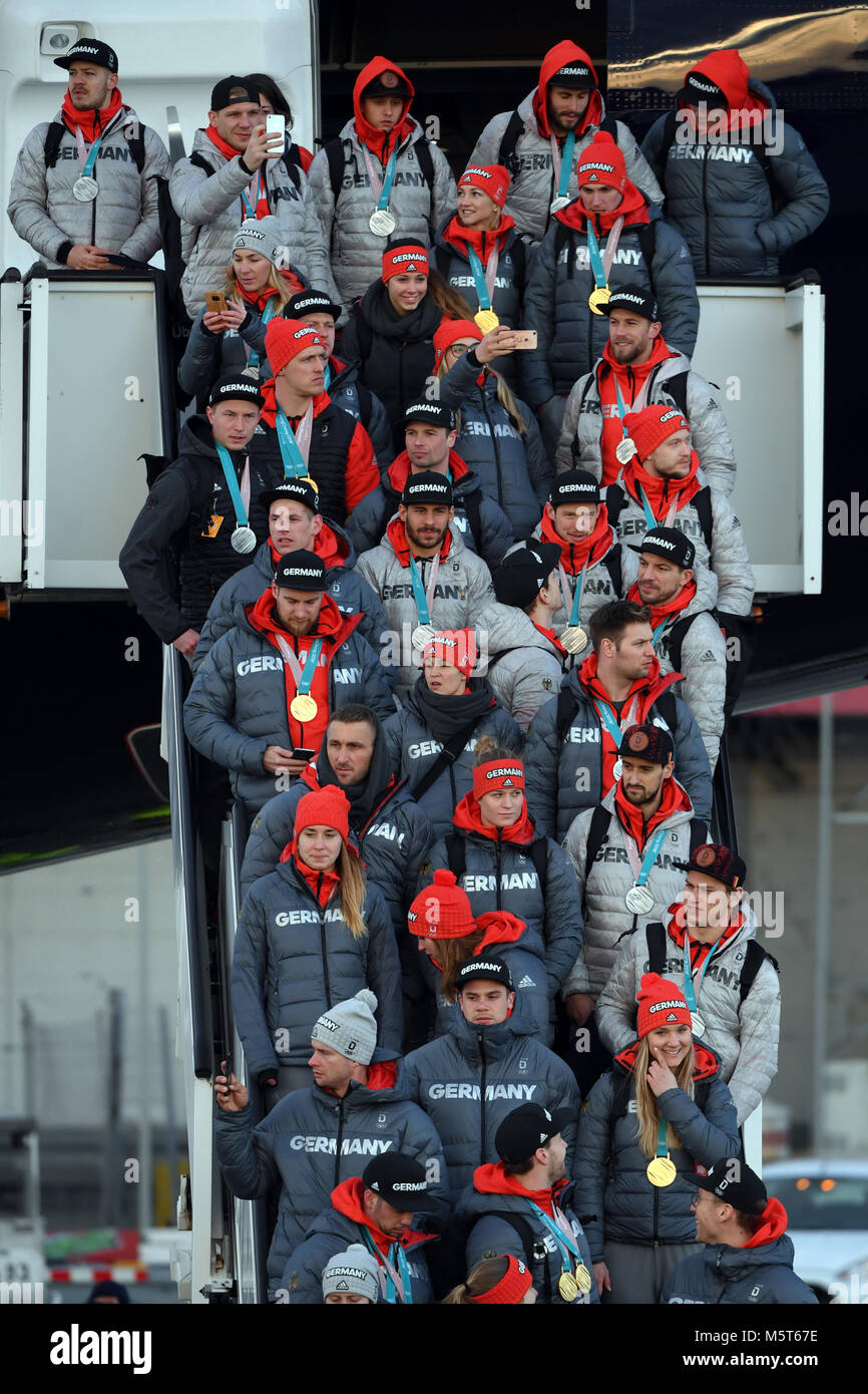 26 February 2018, Germany, Frankfurt am Main: German athletes stand on the gangway after the landing of the Lufthansa aircraft LH713 with more than 150 other athletes, coaches and officials on board. Photo: Arne Dedert/dpa Stock Photo