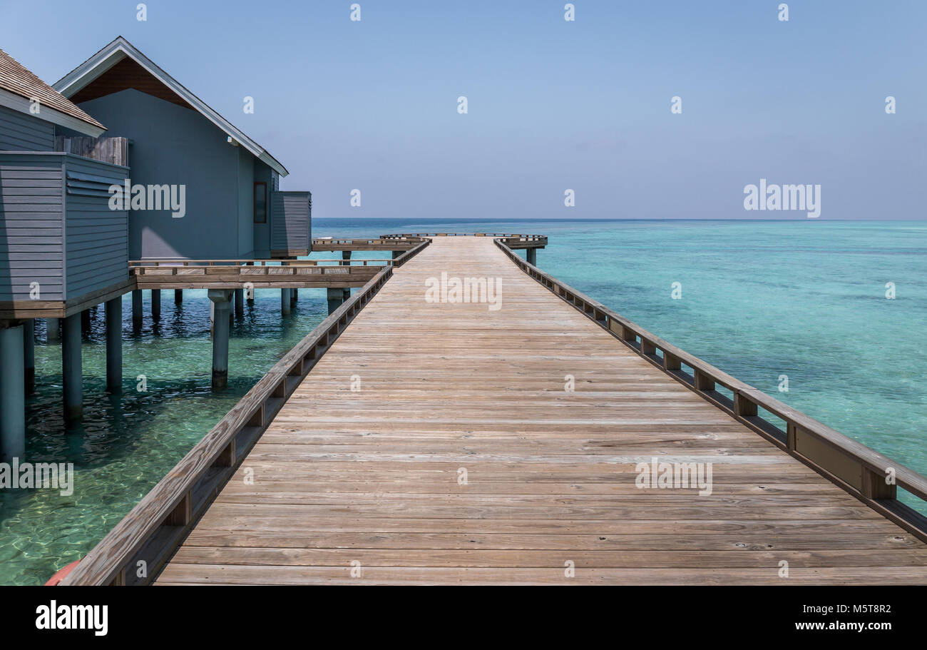 Wooden jetty and turquoise Indian ocean in exotic Maldives Stock Photo ...