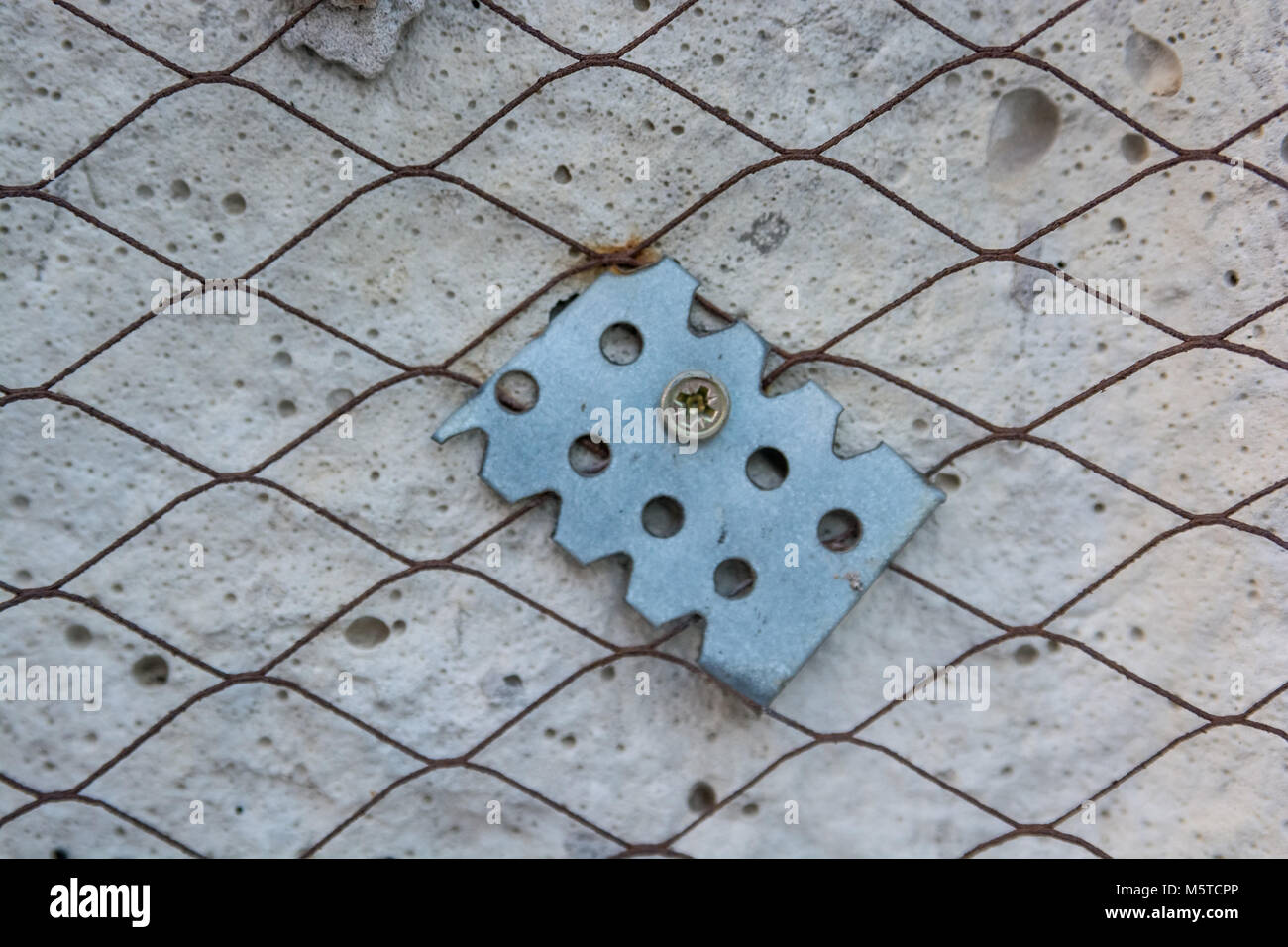 Piece of suspension on plaster wall close Stock Photo Alamy