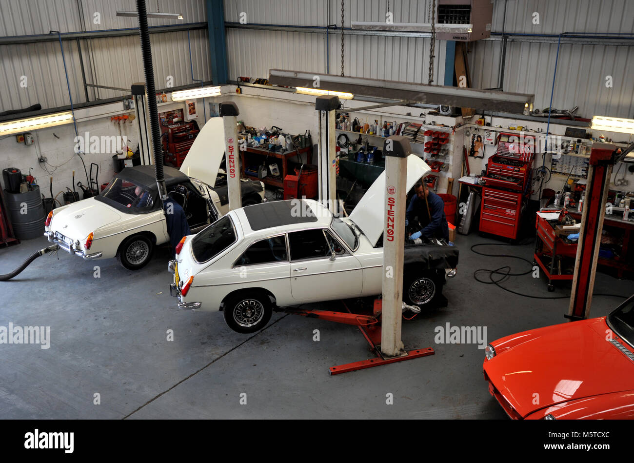 MGB classic cars in a workshop Stock Photo