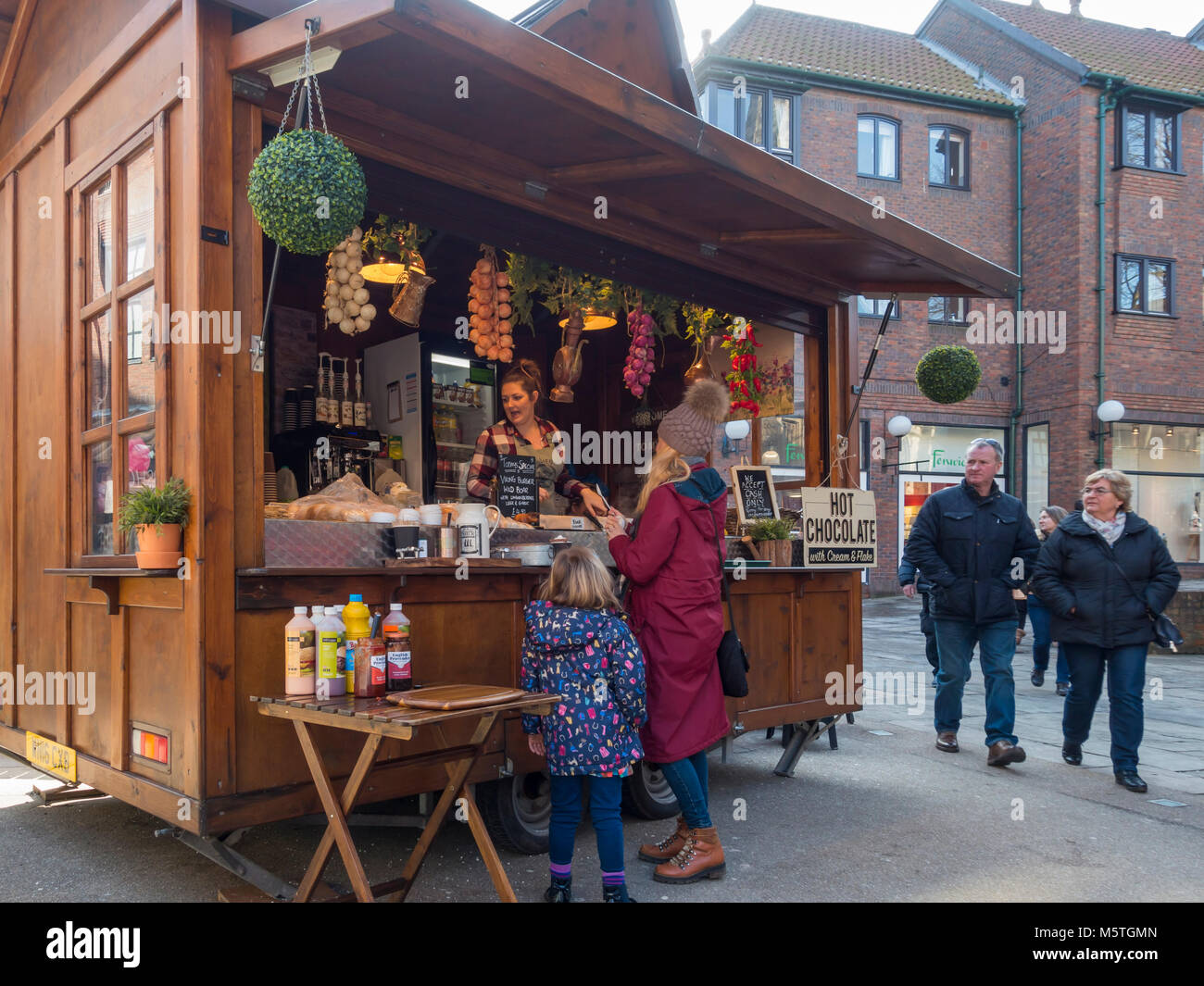 Mother and daughter buying Viking themed fast food near the Jorvik Viking Centre in York City Centre England UK Stock Photo