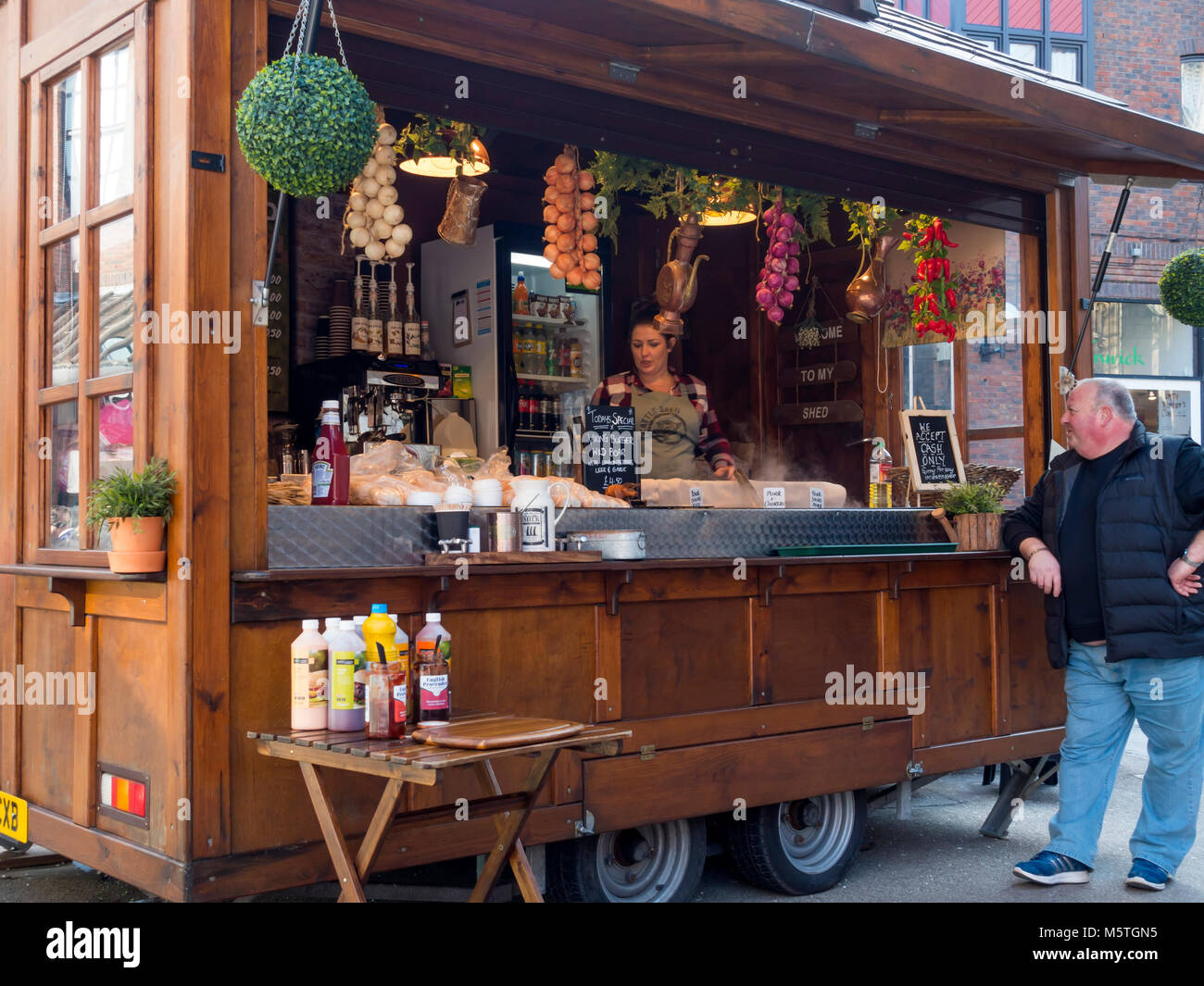 A man buying Viking themed fast food near the Jorvik Viking Centre in York City Centre England UK Stock Photo