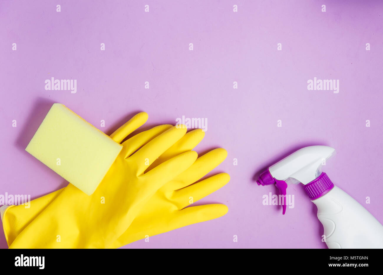 Cleaning Products. Home Cleaning Concept. Lilac Background. Place for Typography and Logo. Copy space. Flat Lay. Top View Stock Photo