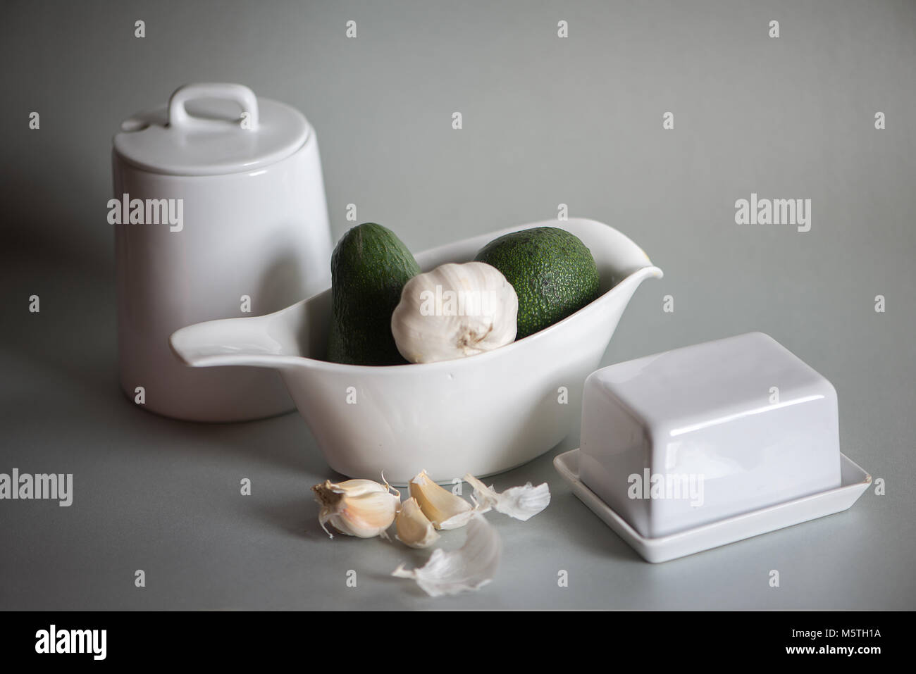 White dishes isolated on gray background Stock Photo Alamy