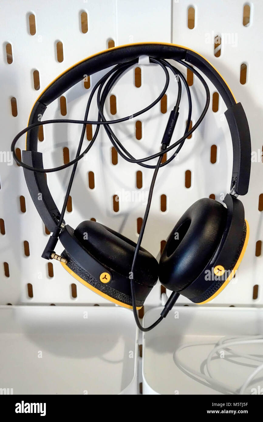 Over Ear Wired Headphones hanging on a hook Stock Photo Alamy