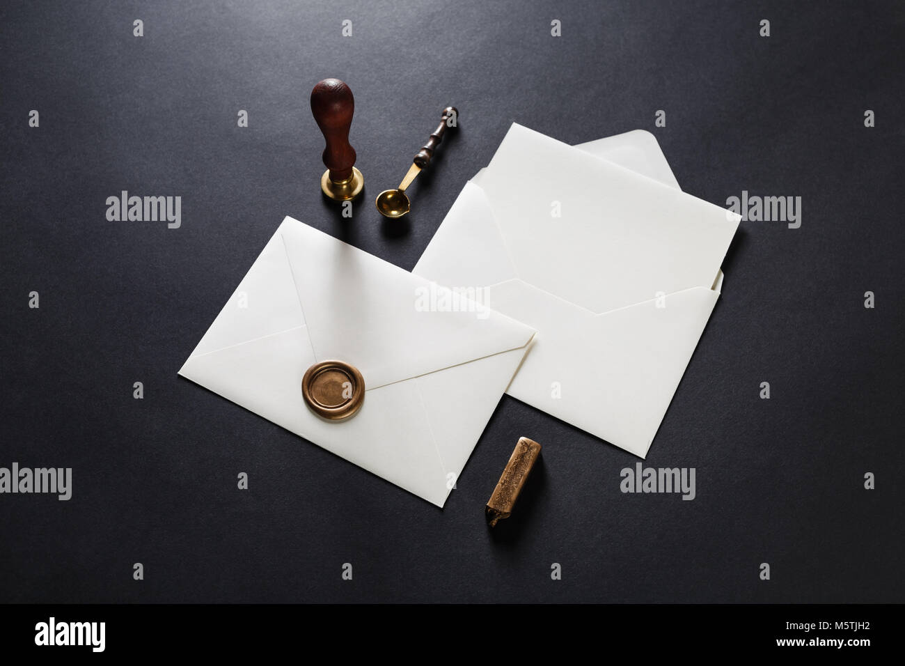 Download Blank Paper Envelopes With Golden Wax Seal Stamp Spoon And Postcard On Black Paper Background Mockup For Your Design Stock Photo Alamy