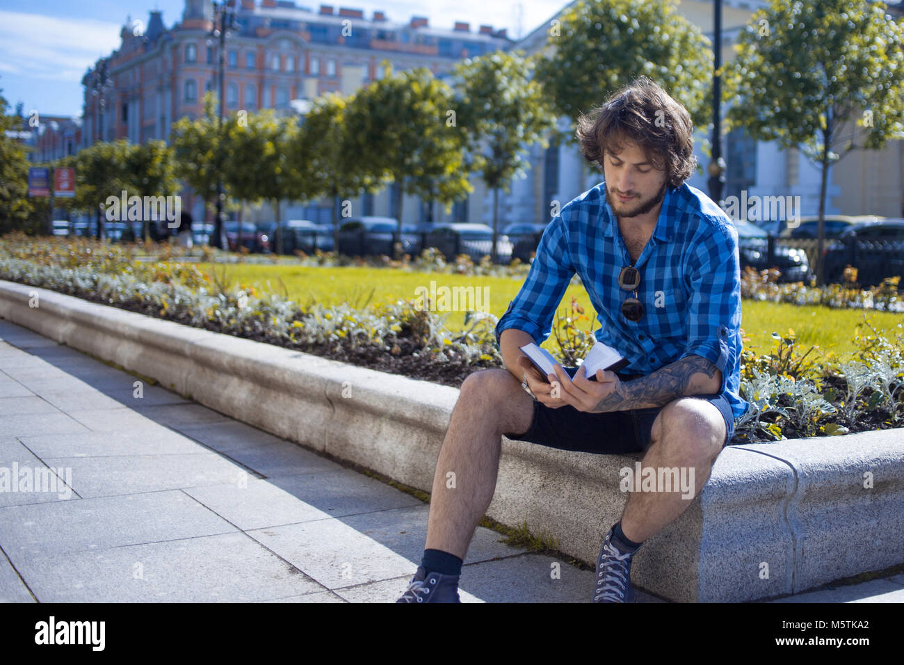 Portrait of young handsome stylish man on the street Stock Photo - Alamy