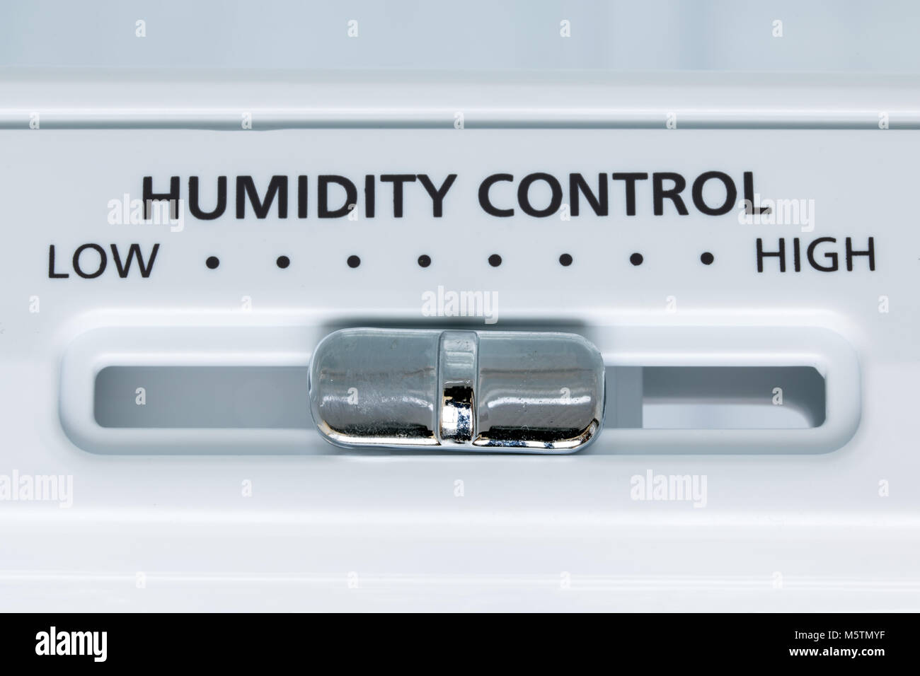 A control of humidity in the fridge, close-up view. Select the degree of humidity in the cooling device. Stock Photo