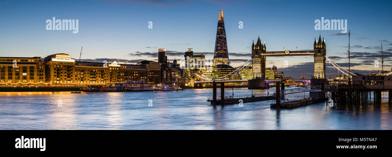 Panoramic view of the London Skyline at Dusk, featuring Tower Bridge, The Shard, Butlers Wharf and the River Thames Stock Photo