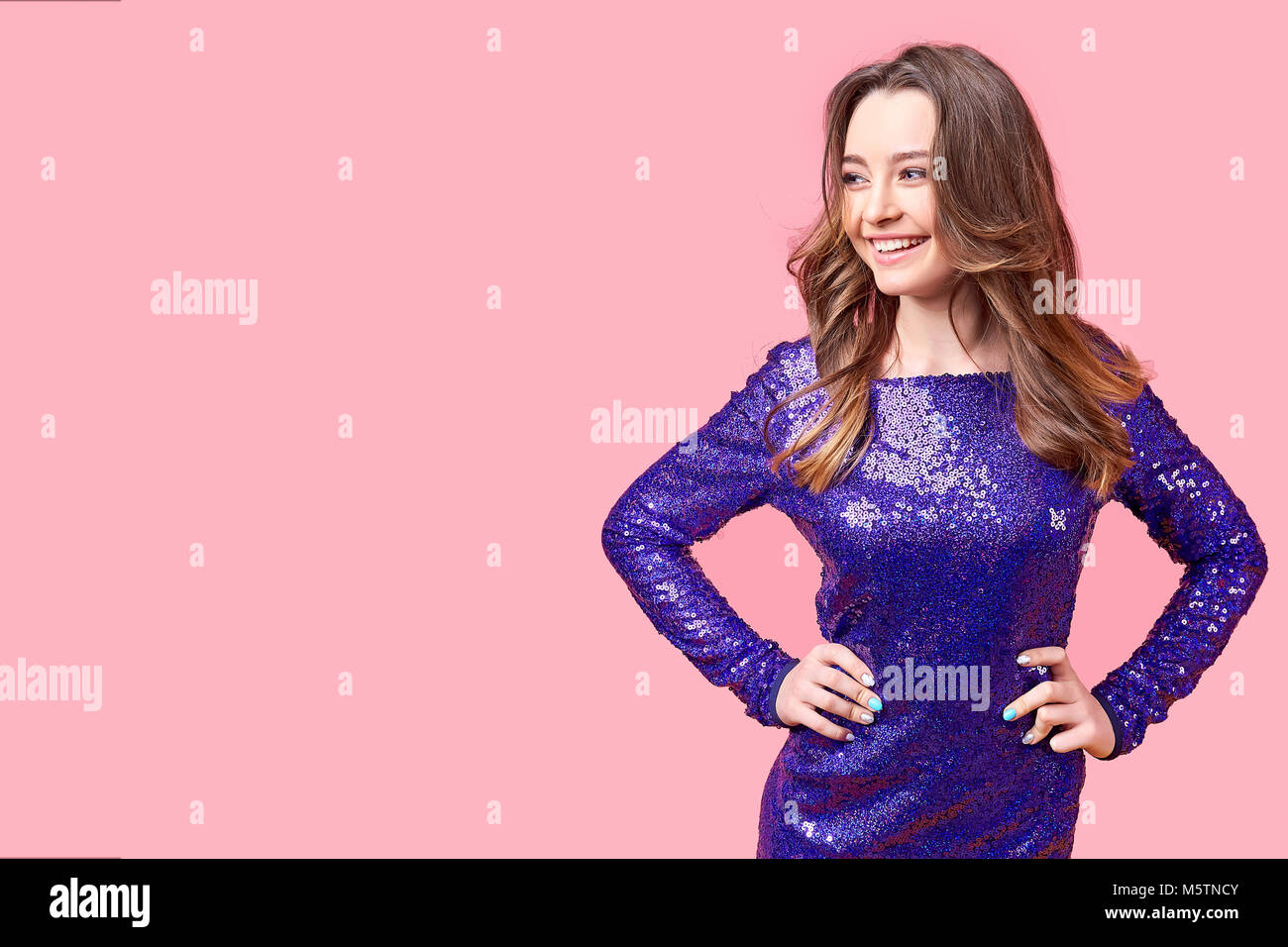 Young woman in purple dress Stock Photo - Alamy