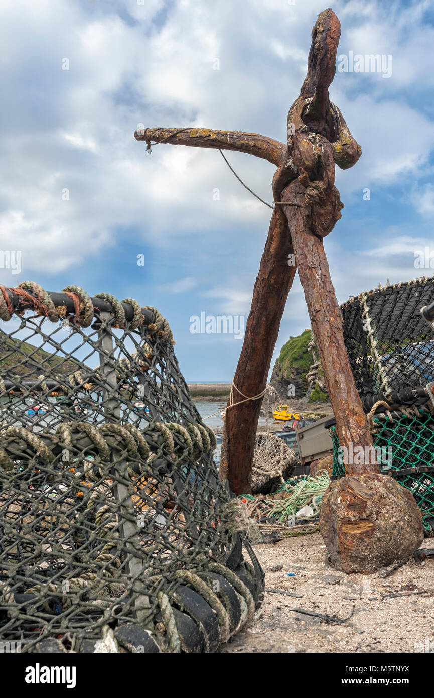 PORT ISAAC, CORNWALL Old Rusty Anchor and Lobster Pots on the harbour