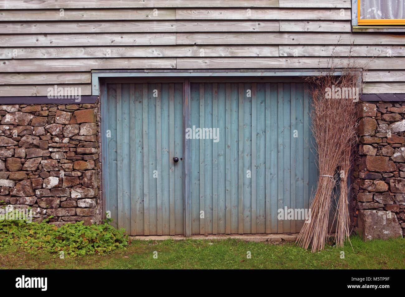 Old Barn Made With A Mix Of Building Materials Stock Photo