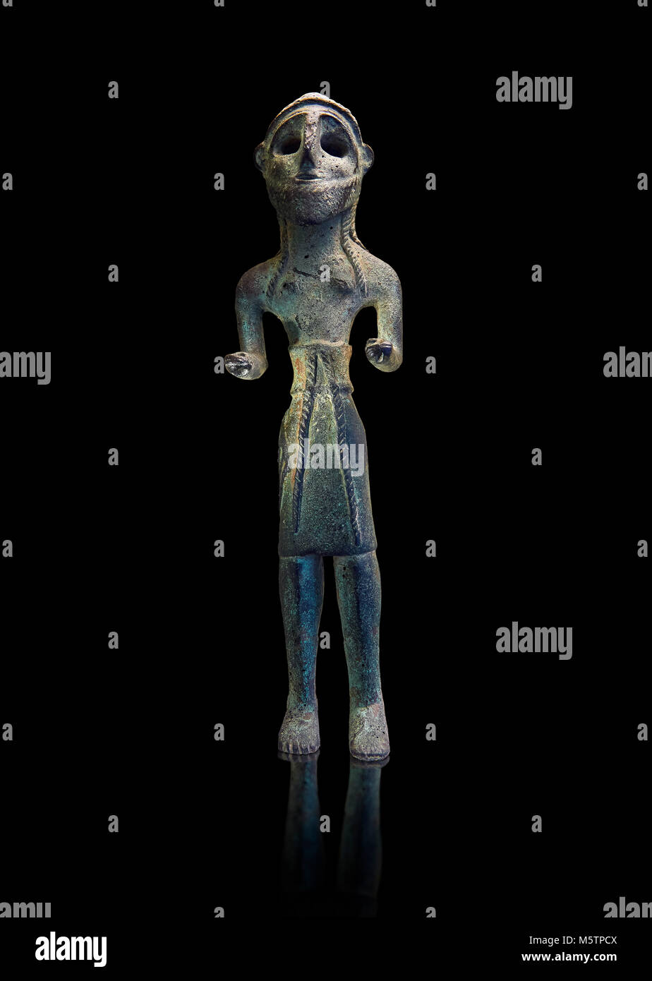 Copper statuettes of warriors with a short loincloth which originally held weapons in their hands, as well as representation of a woman. These acquire Stock Photo