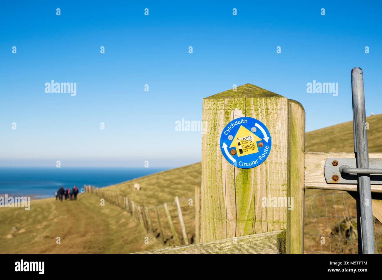 Circular Route footpath sign on North Wales Path with view to coast. Abergwyngregyn, Gwynedd, Wales, UK, Britain Stock Photo