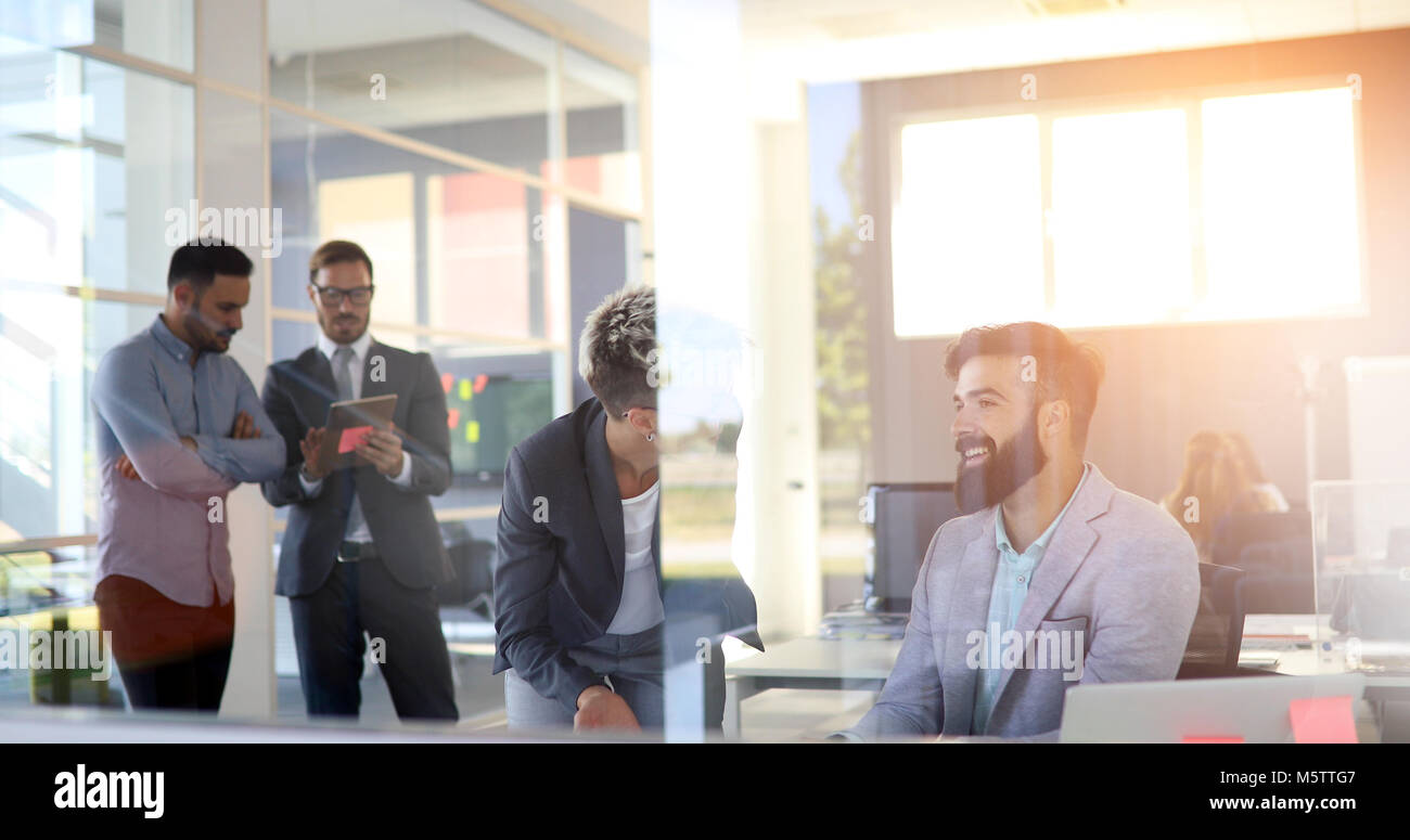 Group of business people collaborating in office Stock Photo - Alamy
