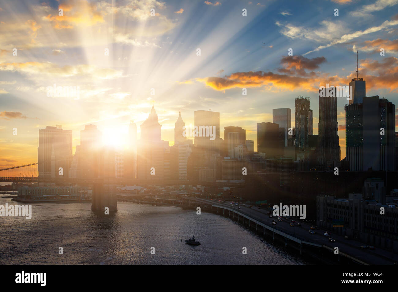 Sun shines on New York City downtown Manhattan skyline Stock Photo - Alamy