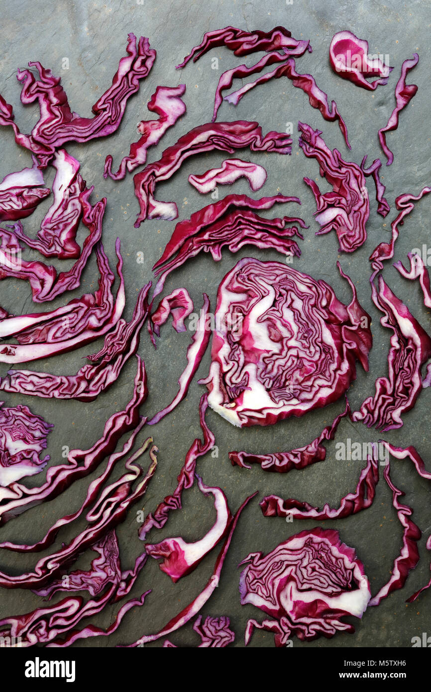 Arrangement of colorful red cabbage on slate table Stock Photo