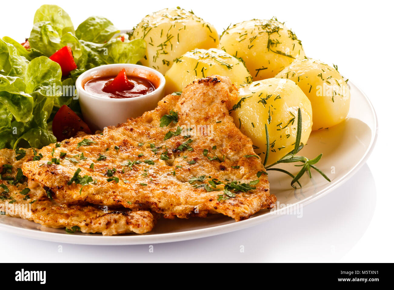 Fried pork chop and vegetables on white background Stock Photo - Alamy