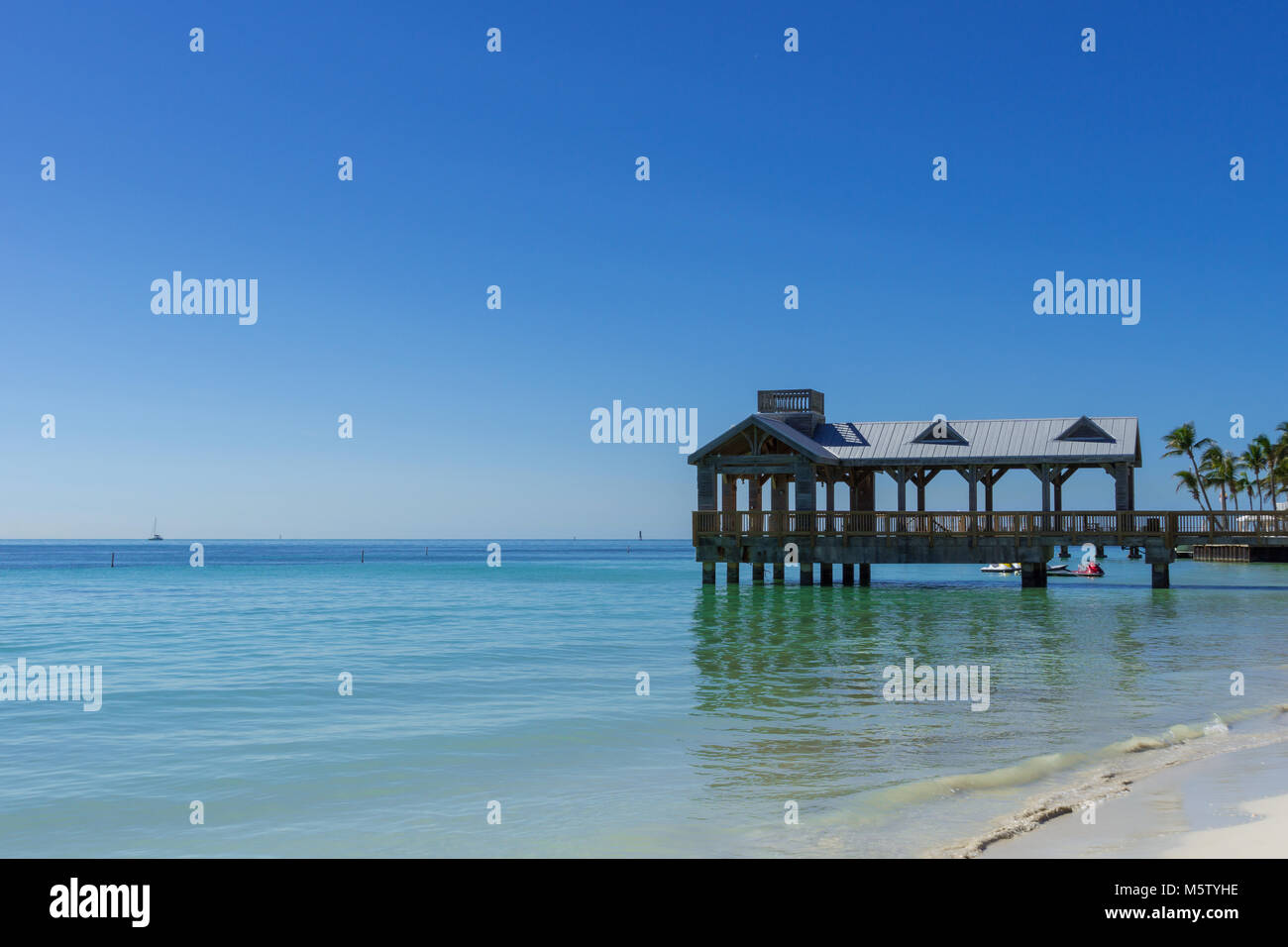 USA, Florida, Landing stage on perfect white sand beach Stock Photo - Alamy