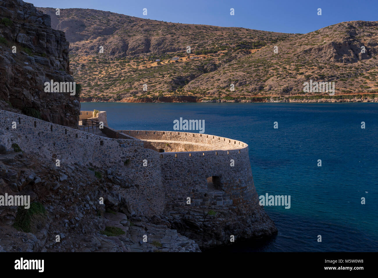 Fortifications on the island of Spinalonga, Crete with the Mediterranean sea Stock Photo