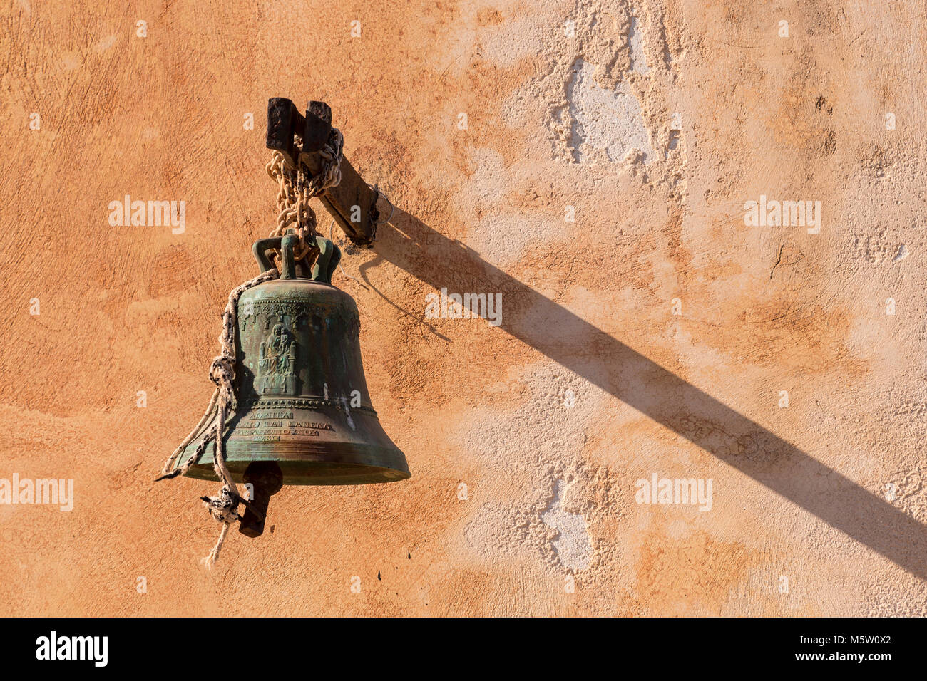 Bell Shadow Image Old bronze bell and shadow on the island of Spinalonga, Crete Stock ...
