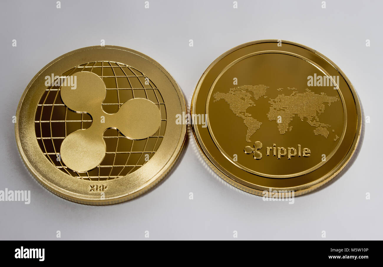 On a white background are gold coins of a digital crypto currency - ripple.  The front and back sides of the gold coin ripple Stock Photo - Alamy