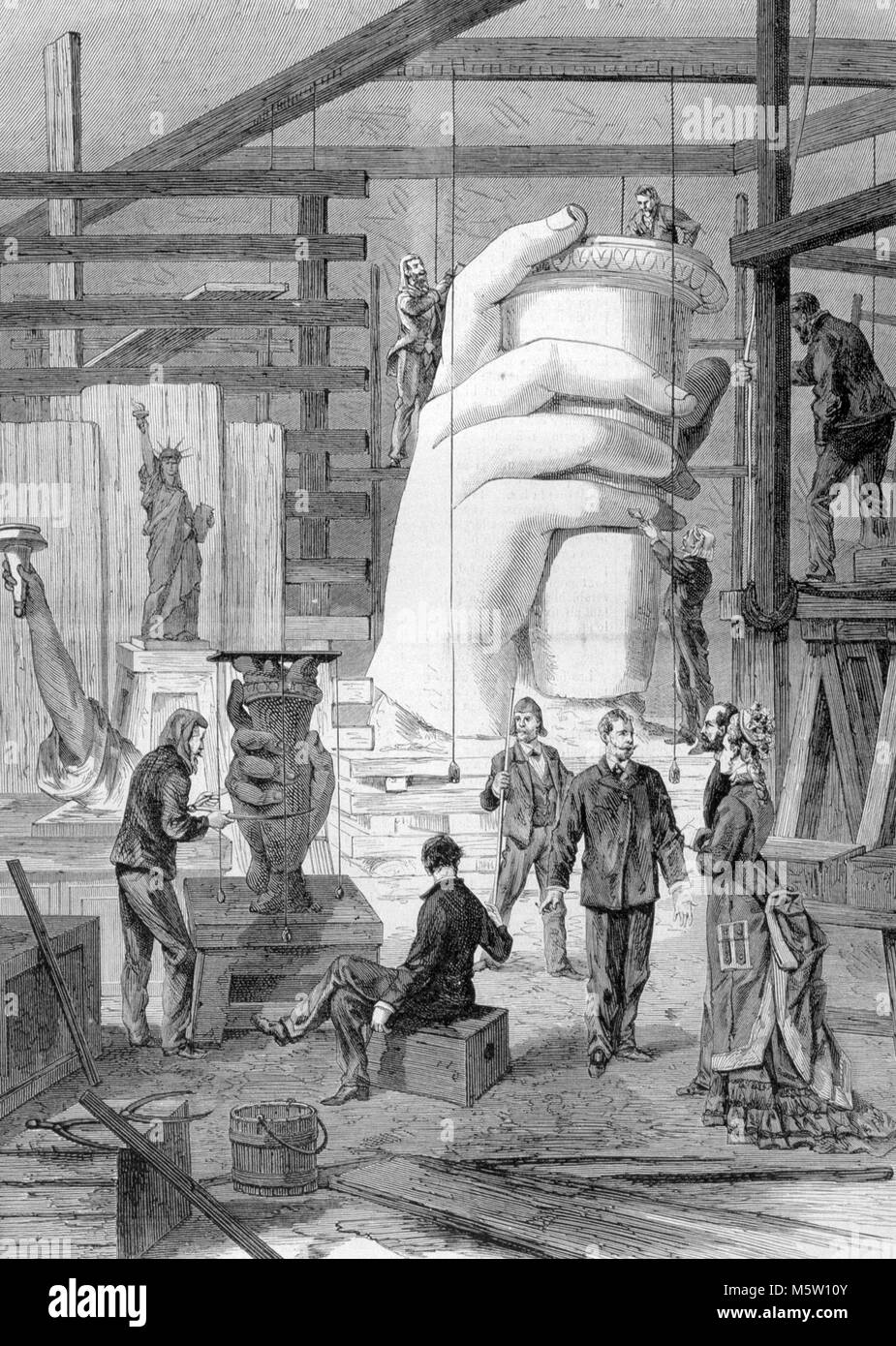 FREDERIC AUGUSTE BARTHOLDI (1834-1904) French sculptor who designed the Statue of Liberty.  The Statue under construction in his Paris studio. Stock Photo