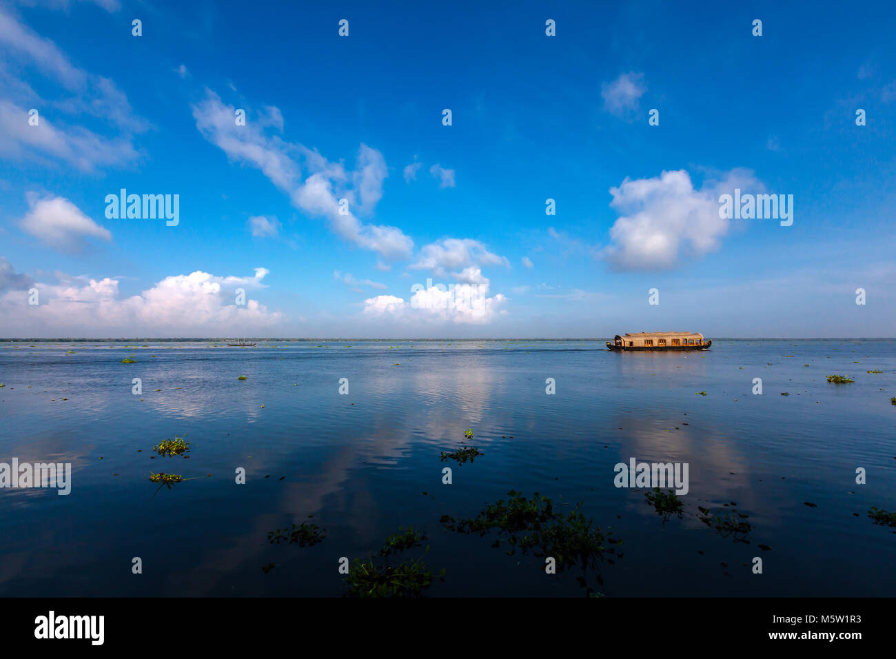 Sailing on a houseboat from Pallathuruthi near Alleppy to Kumarakom in Kerala, India. Stock Photo