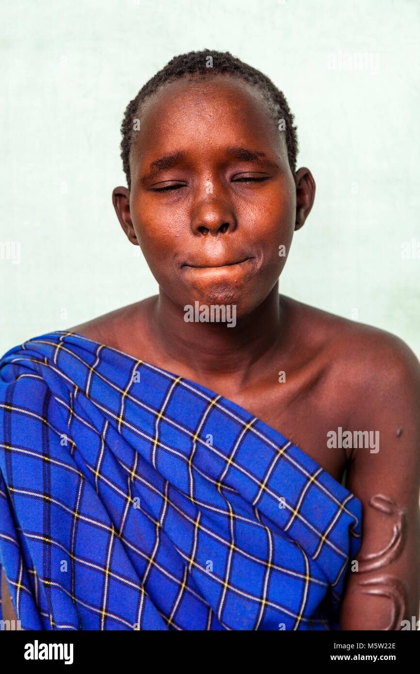 A Portrait Of A Young Woman From The Bodi Tribe, Bodi Village, Omo Valley, Ethiopia Stock Photo