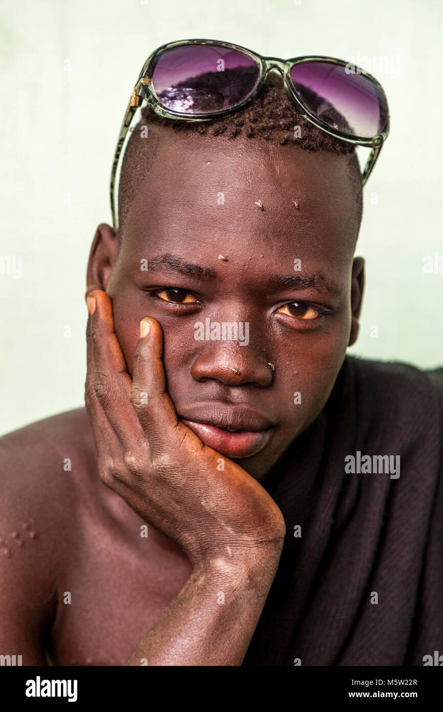 A Portrait Of A Young Man From The Bodi Tribe, Bodi Village, Omo Valley, Ethiopia Stock Photo