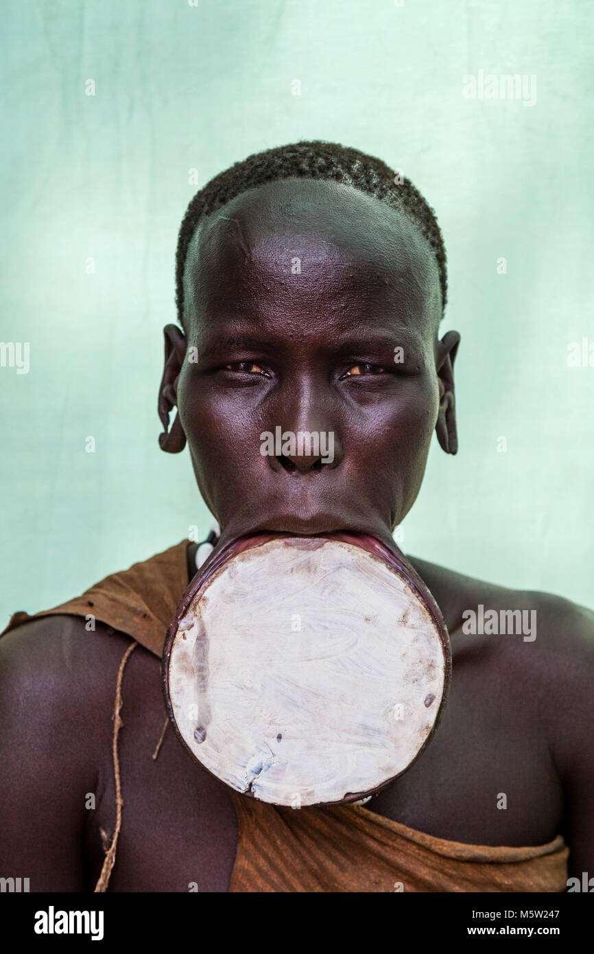 A Portrait Of A Young Woman From The Mursi Tribe, Mursi Village, Omo ...