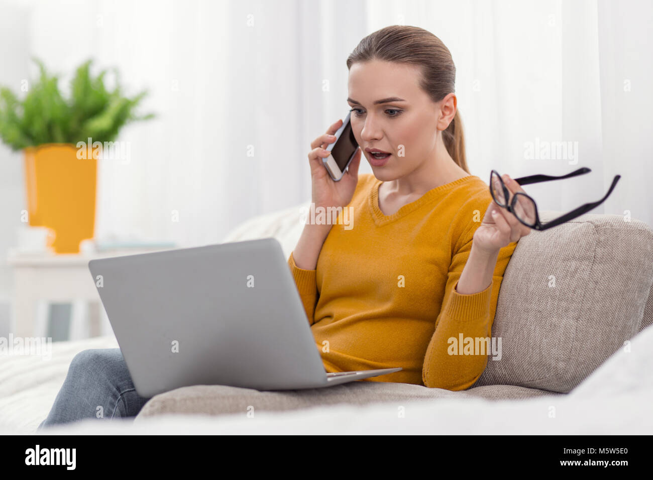 Surprised shocked businesswoman consulting about issue Stock Photo