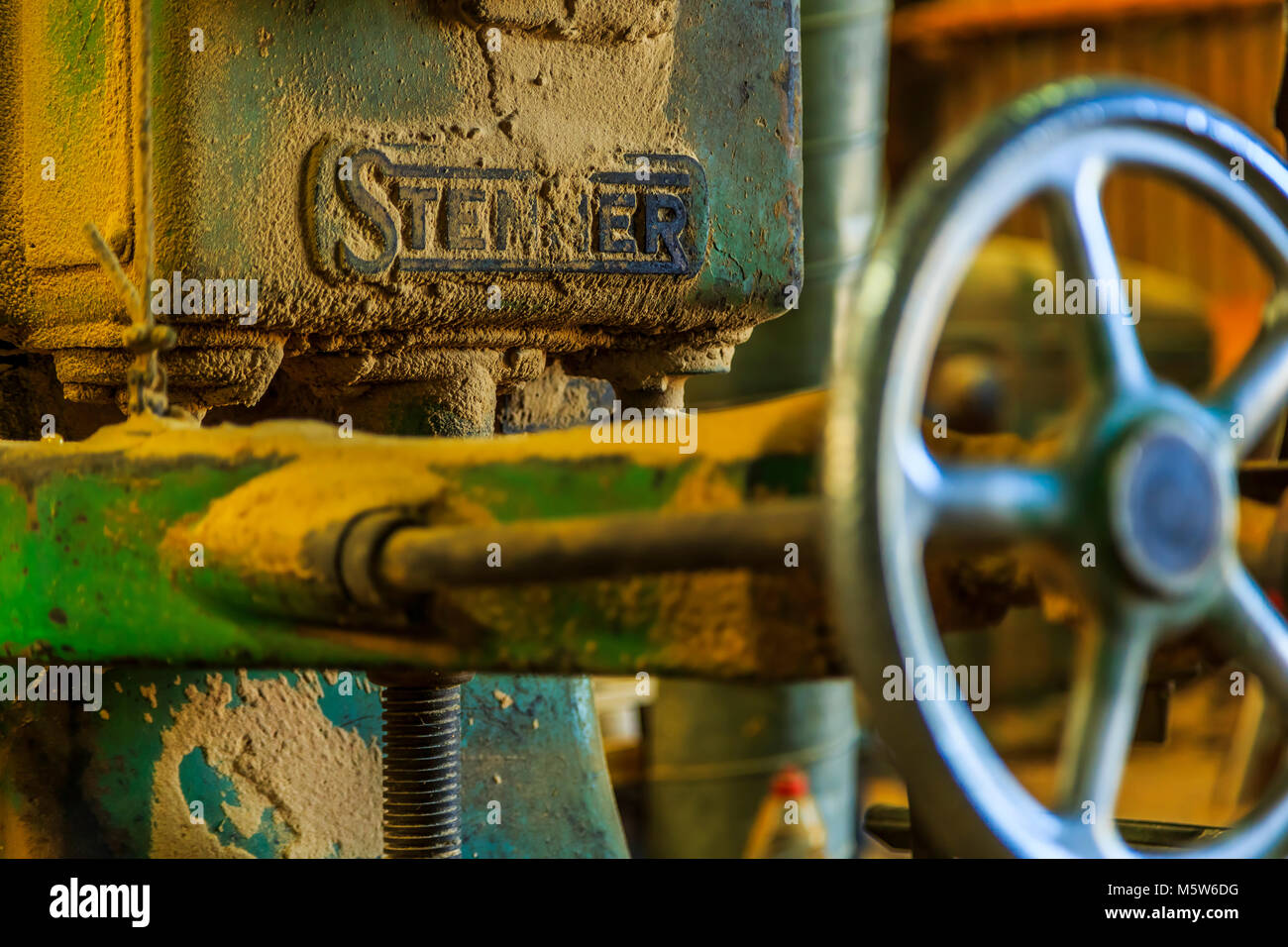 An old dusty Stenner Woodworking plant in a sawmill. Stock Photo
