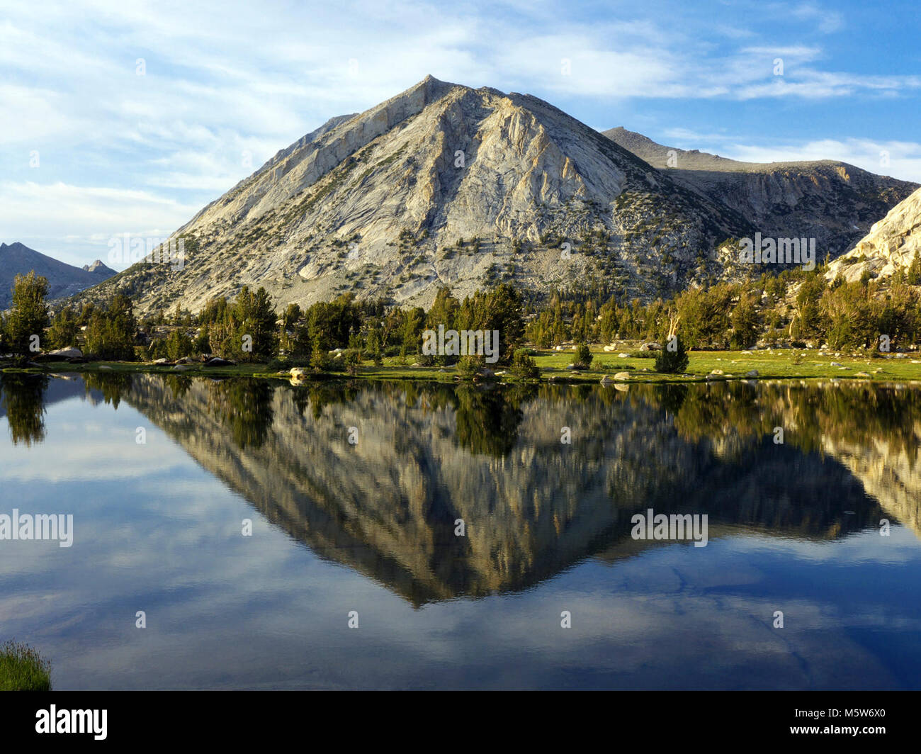Wildlife Range Shifts . Mountain reflection in lake. Stock Photo