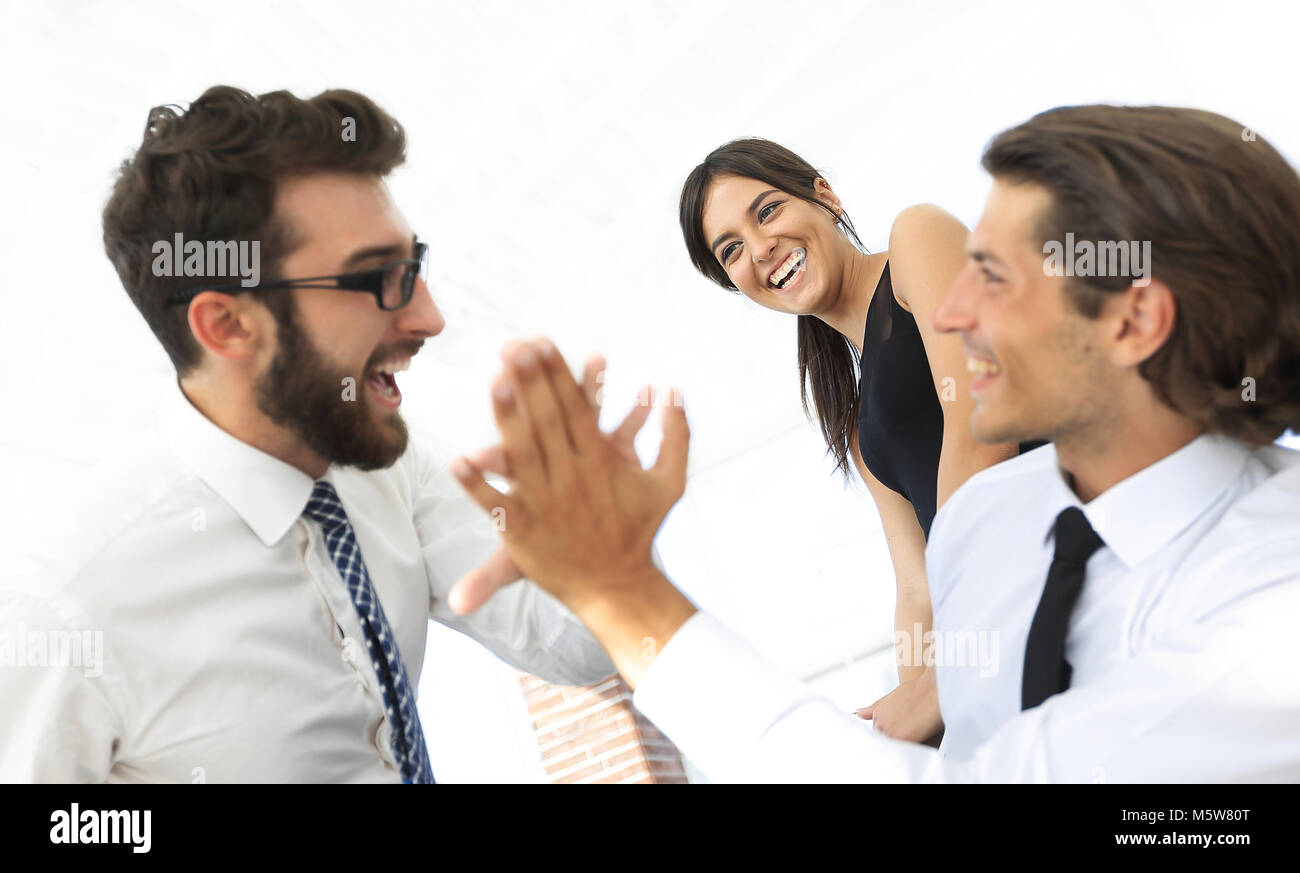 business colleagues giving each other high five Stock Photo - Alamy