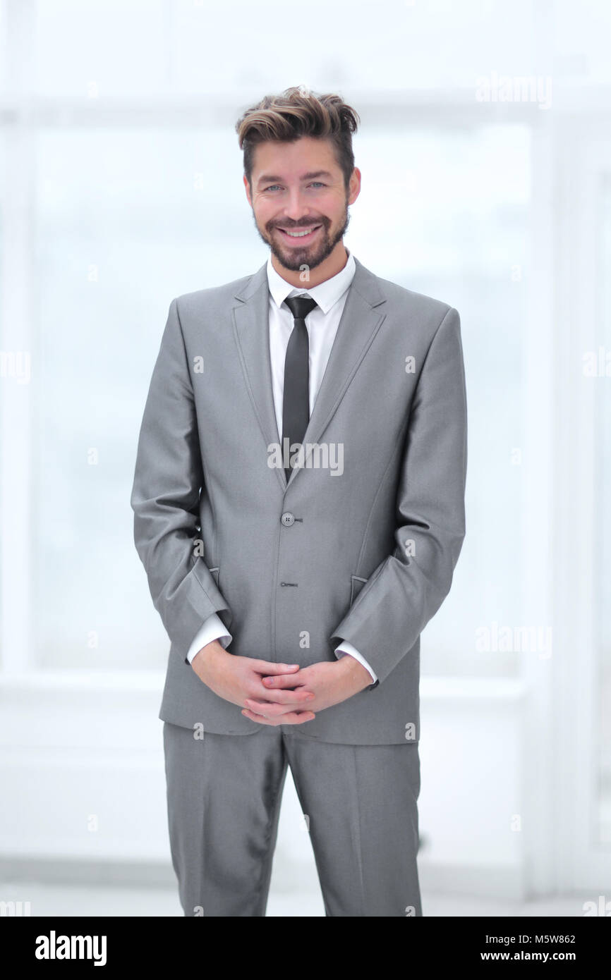 A young man in a gray suit Stock Photo - Alamy