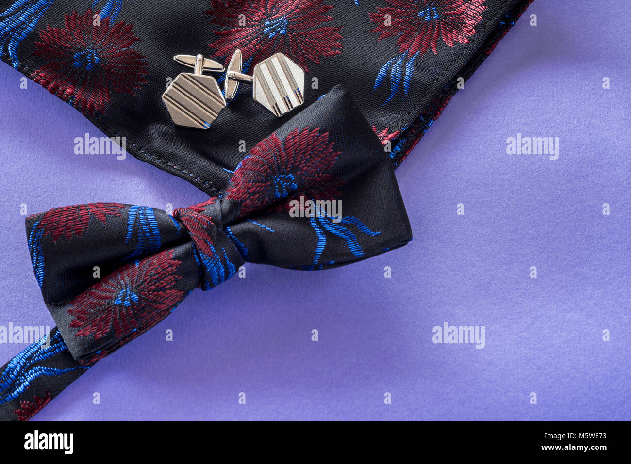 Bow tie silver cufflinks and handkerchief. Stock Photo