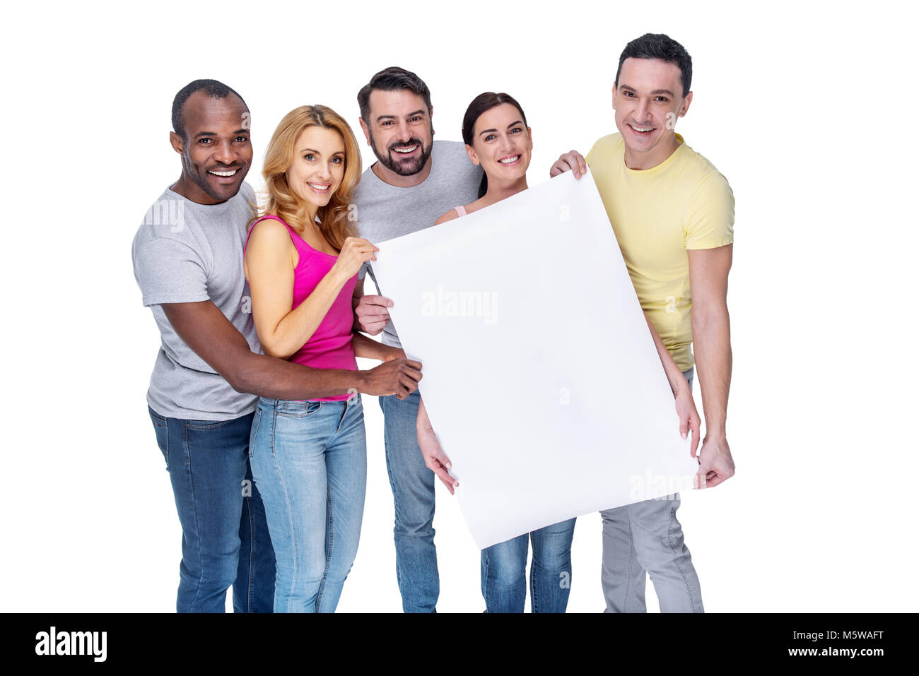 Smiling best friends holding a placard Stock Photo - Alamy
