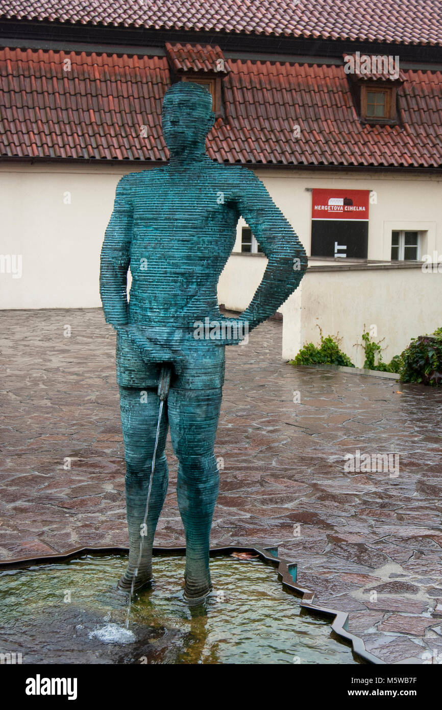 outside pissing  outdoor sculpture and fountain (peeing statue) by Czech artist David  Cerny, installed outside the Franz Kafka Museum in Prague, Czech Republic  Stock Photo - Alamy